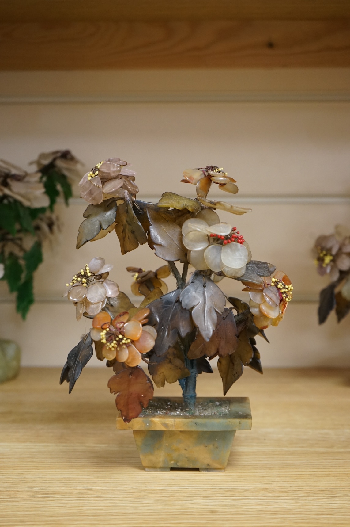 A collection of four ornamental Chinese hardstone flowering trees, tallest 22cm.